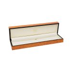 A beautiful, veneered wooden gift box pictured open.