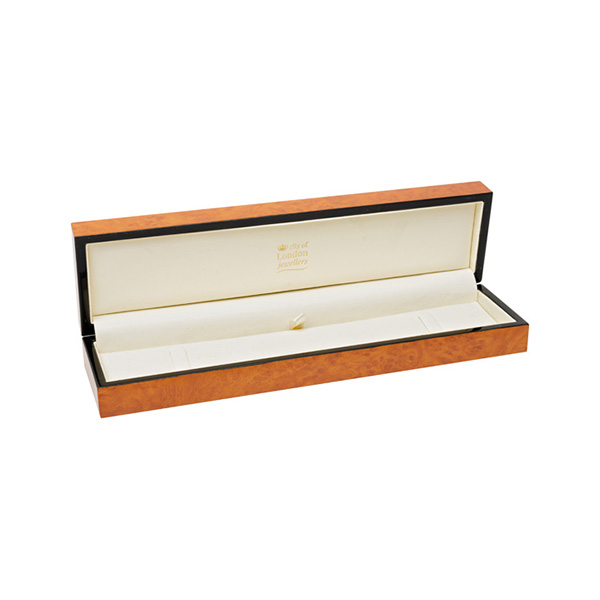 A beautiful, veneered wooden gift box pictured open.