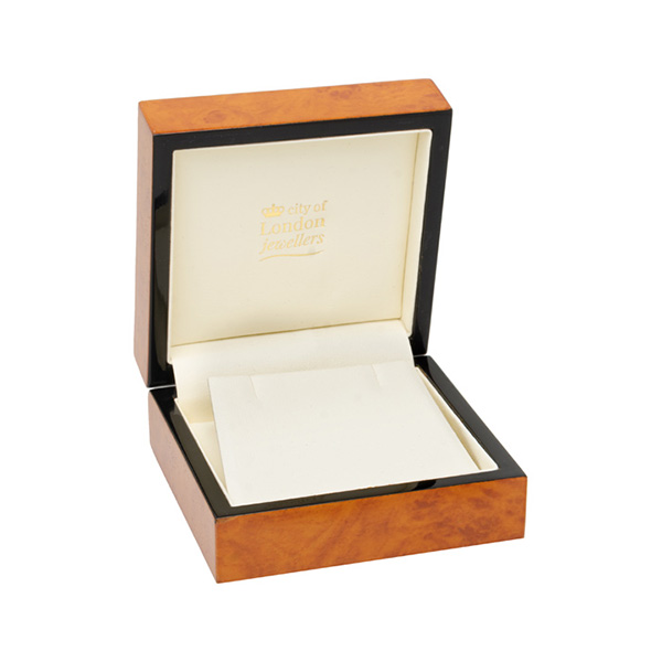 A beautiful, veneered wooden gift box pictured open.