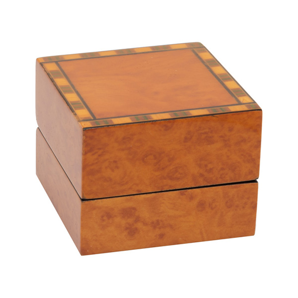 A beautiful, veneered wooden gift box pictured closed.