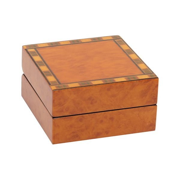A beautiful, veneered wooden gift box pictured closed.