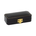 Antique style hinged cufflink box with black leatherette outside covering with black interior base pad with two elastic holders and white silk inner lid with a gilt colour catch. The picture shows the box closed.