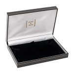 Black leatherette box with a black pad base and a white silk inner lid. Pictured open.