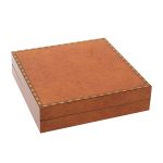 A beautiful, veneered wooden gift box pictured closed.