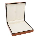 A beautiful, veneered wooden gift box pictured open.
