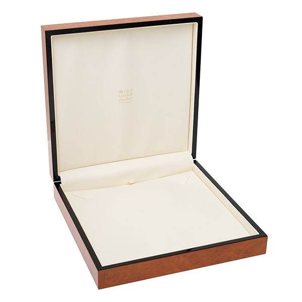 A beautiful, veneered wooden gift box pictured open.