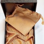 Inside of the Hoxton cufflink box showing light golden brown silk with matching pouch