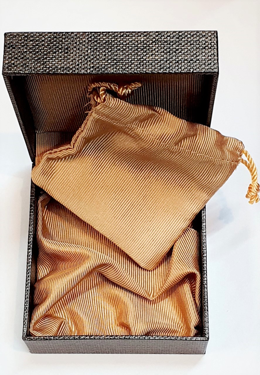 Inside of the Hoxton cufflink box showing light golden brown silk with matching pouch