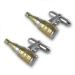Sterling silver champagne bottle cufflinks with gold‑plated detail displayed on a clean white background, showing their polished finish and miniature design with crisp, high‑clarity lighting.