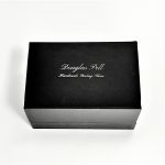  Douglas Pell's luxurious gift box for cufflinks closed, showing the Douglas Pell logo on the top.