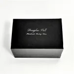  Douglas Pell's luxurious gift box for cufflinks closed, showing the Douglas Pell logo on the top.