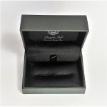 Douglas Pell's luxurious gift box for cufflinks is open and has the Douglas Pell logo on the top and inside of the lid.