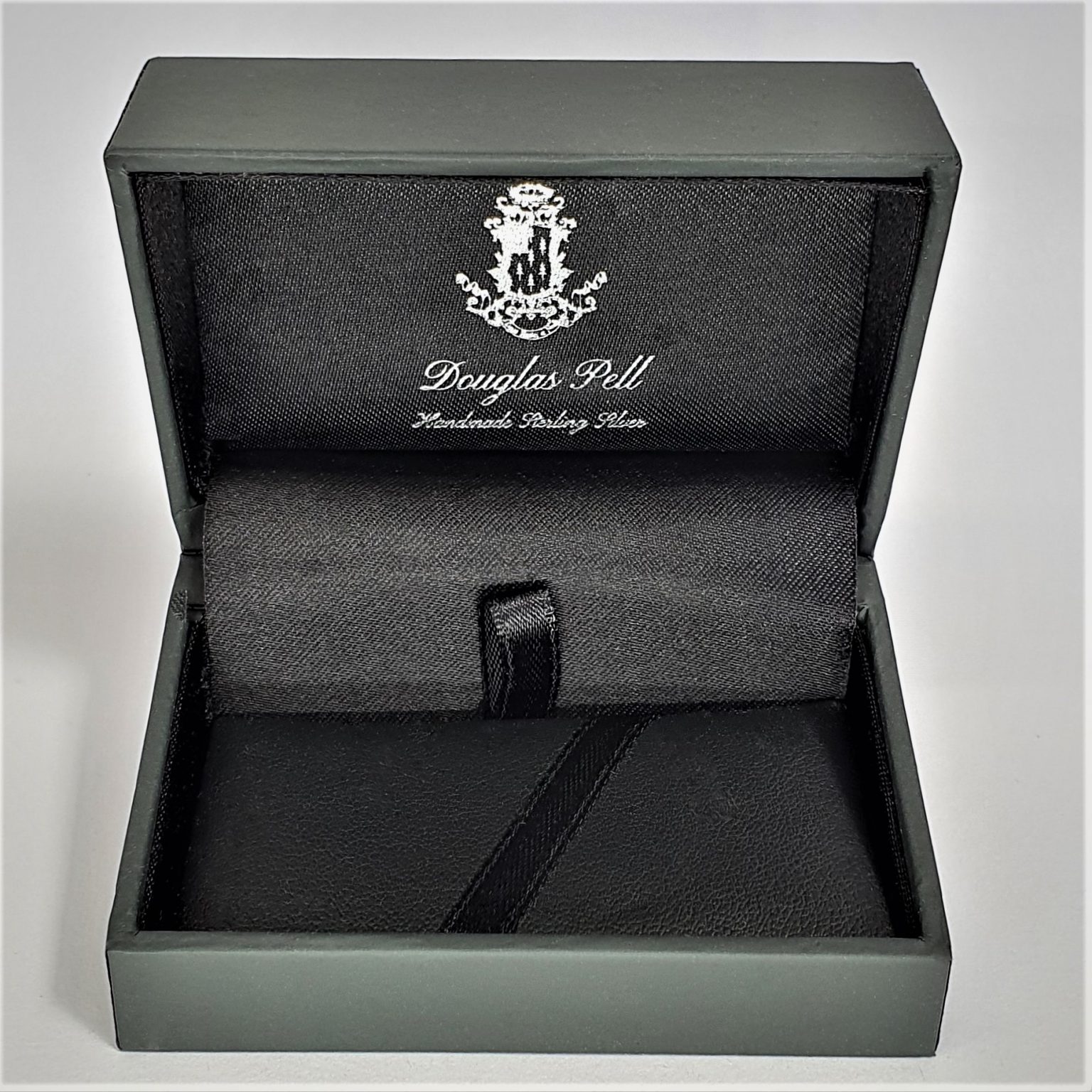 Douglas Pell money clip box showing front view open.