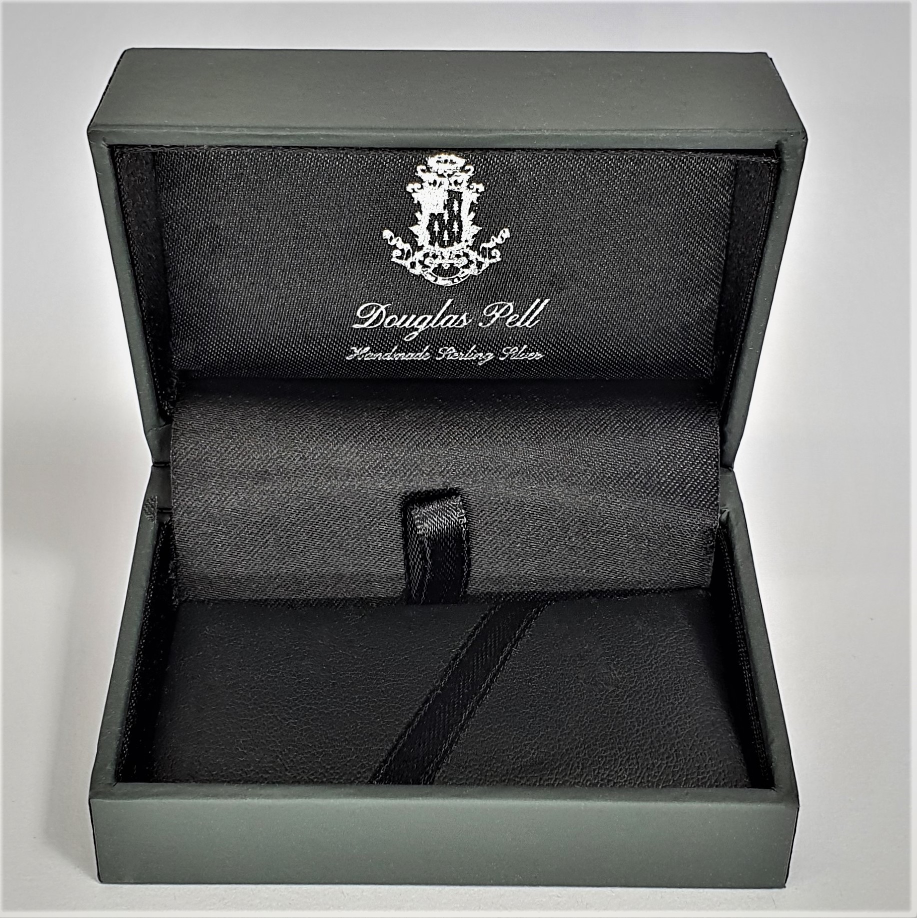 Douglas Pell money clip box showing front view open.