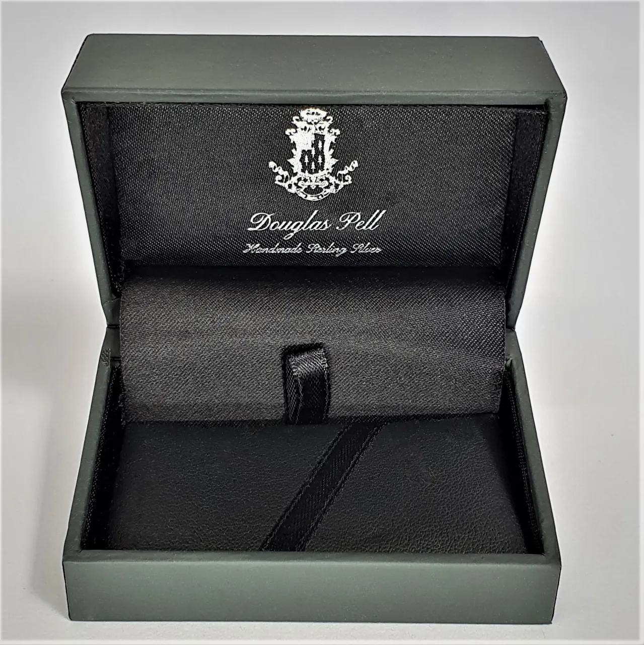 Douglas Pell money clip box showing front view open.