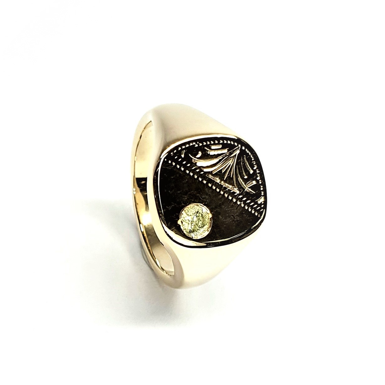 9ct Gold Cushion shaped Heavy signet ring with a Scroll pattern engraved in one corner and a single champagne colour Diamond in the other corner.