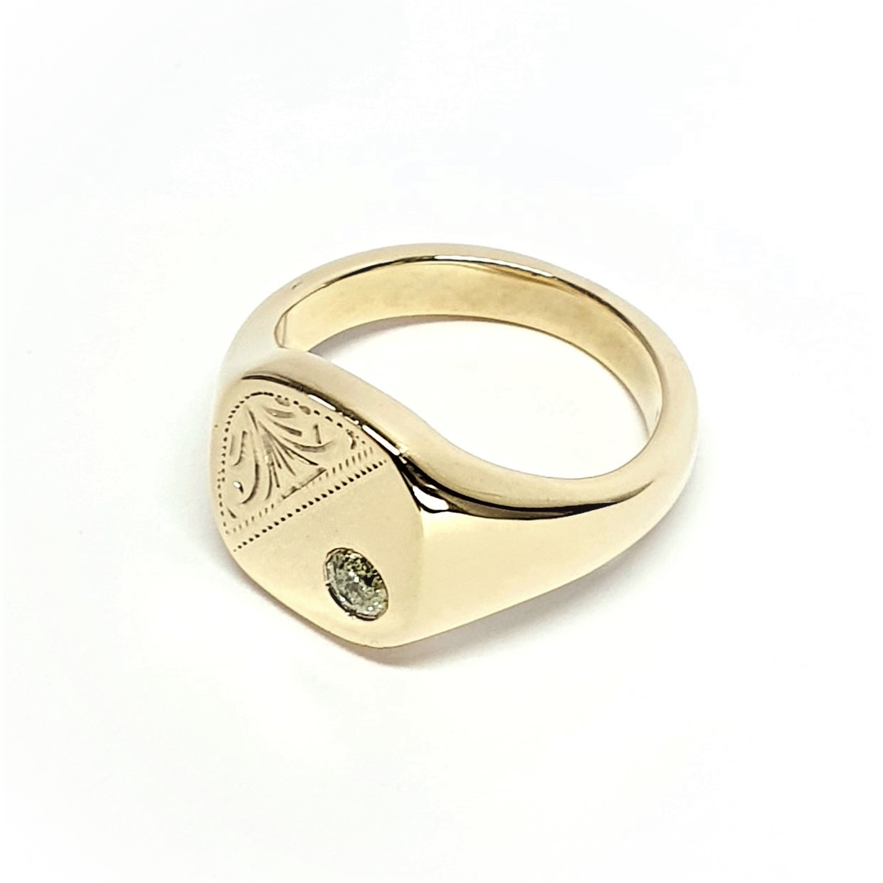 9ct Gold Cushion shaped Heavy signet ring with a Scroll pattern engraved in one corner and a single champagne colour Diamond in the other corner.