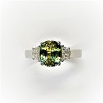 Close top view highlighting the sapphire’s colour and the diamonds’ bright detail.