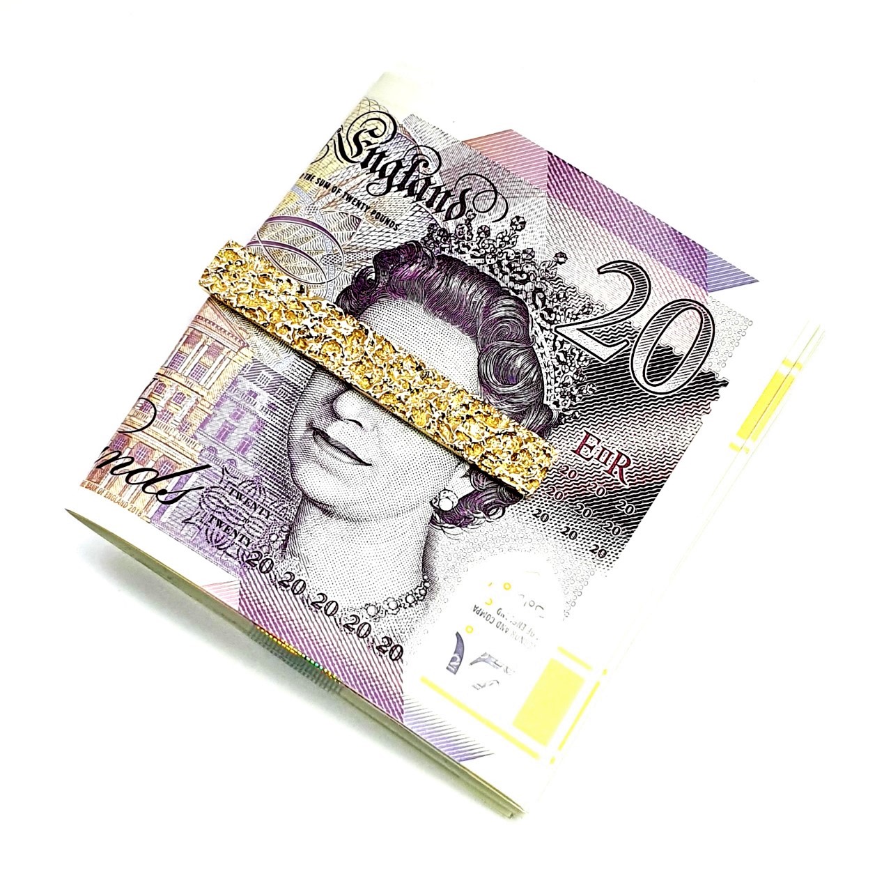 Gold clip for your cash with melted gold ,bar design displayed with a twenty pound note