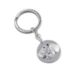 Genuine 925 silver key ring with the face of a Dachshund dog with blue sapphire eyes. Facing the front.