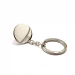 Genuine 925 silver key ring with the face of a Dachshund dog with blue sapphire eyes. Showing the back disc.