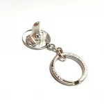 Genuine 925 silver key ring with the face of a Dachshund dog with blue sapphire eyes.