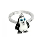 Hallmarked sterling silver with black & white enamelled head & body with polished silver beak & feet with a silver split ring for attaching to your key ring.