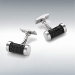 "Exquisite craftsmanship: Shagreen embossed black leather and sterling silver cylindrical cufflinks, a sophisticated accessory for the modern gentleman."