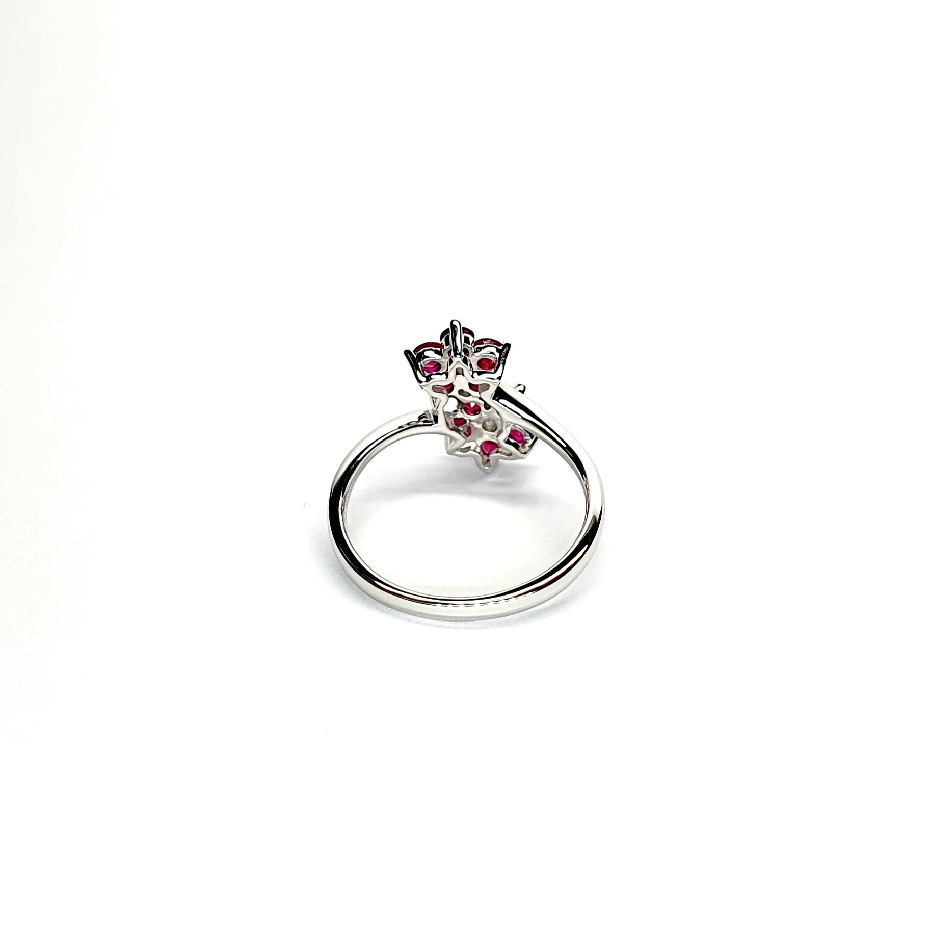 Ruby Double Cluster Ring with claw settings crafted in 18ct white gold featuring two clusters of five round bright red rubies with a single diamond centre to each cluster