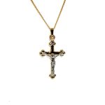 The Staveley 9ct Crucifix Necklace is 32mm with the top saddle loop 25mm x 16.8mm without and is 2mm in depth. It is made with a hollow 9ct yellow gold tube with a white gold Jesus, all highly polished. It can be purchased independently or with a 16, 18 or 20-inch traditional solid gold curb link chain.