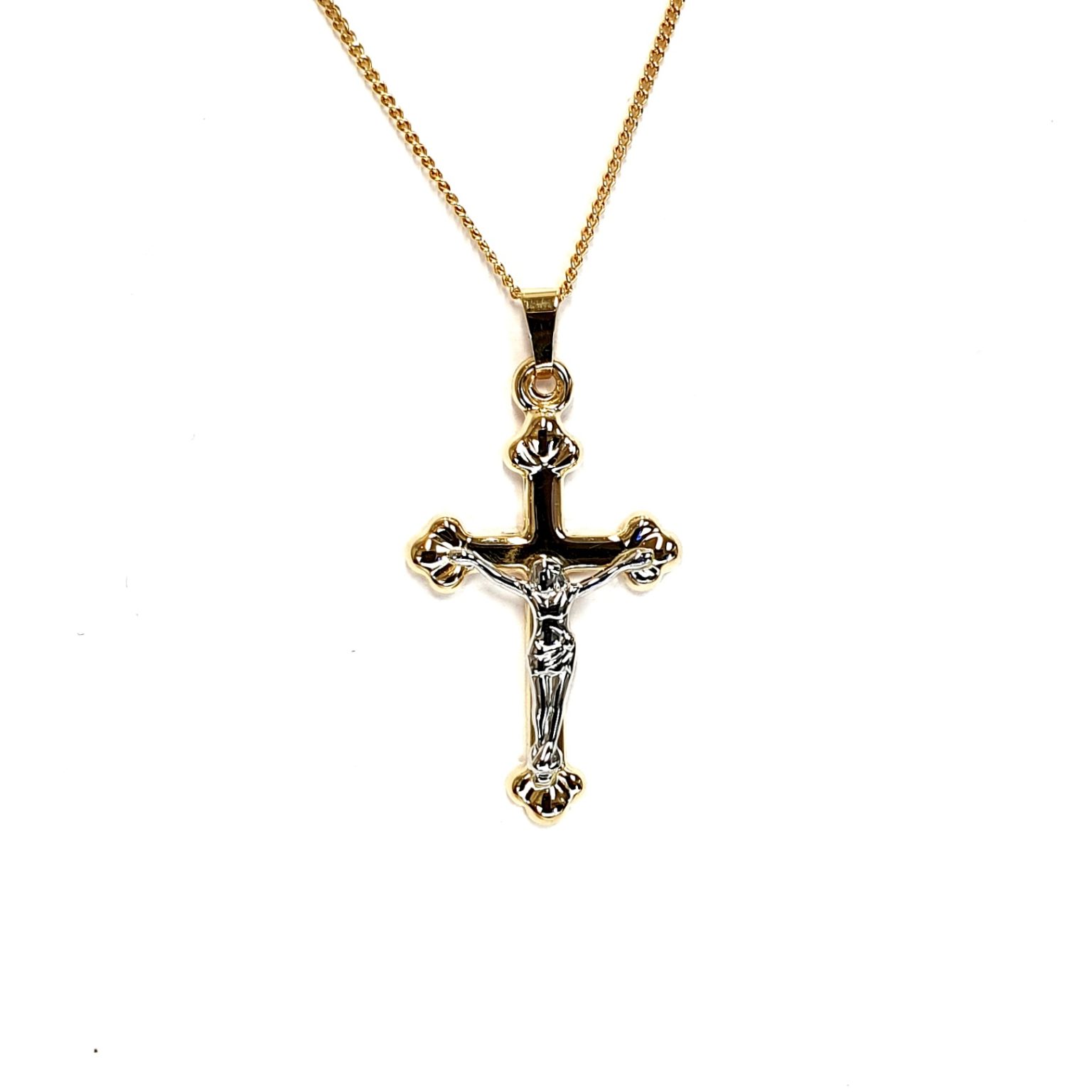 The Staveley 9ct Crucifix Necklace is 32mm with the top saddle loop 25mm x 16.8mm without and is 2mm in depth. It is made with a hollow 9ct yellow gold tube with a white gold Jesus, all highly polished. It can be purchased independently or with a 16, 18 or 20-inch traditional solid gold curb link chain.