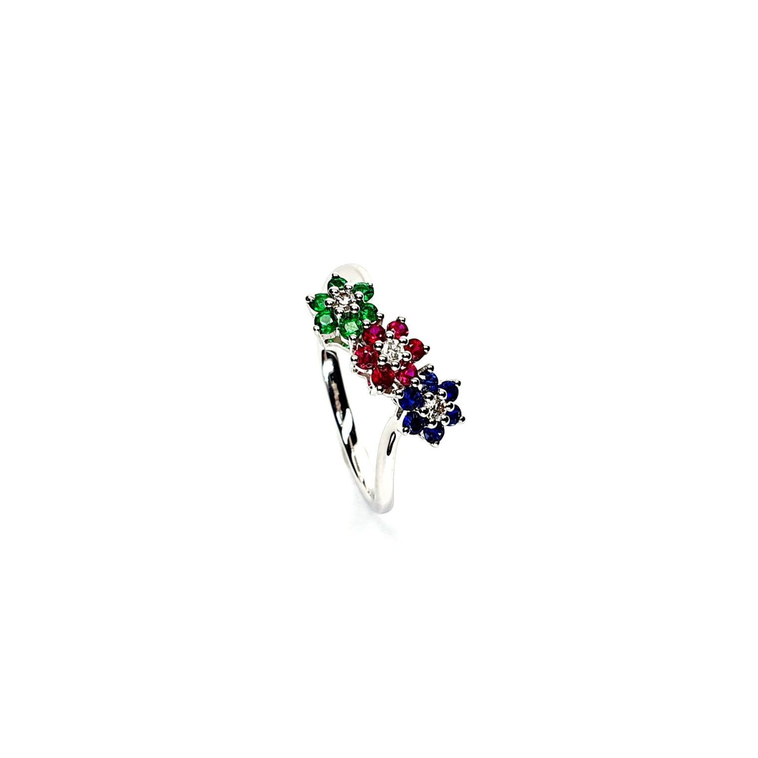 "18ct White Gold Sapphire, Ruby, Emerald & Diamond Three-Cluster Ring: Mesmerizing beauty with vibrant gemstones, exquisite craftsmanship, elegant crossover wave shank, and unmatched quality."