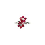 Ruby Double Cluster Ring with claw settings crafted in 18ct white gold featuring two clusters of five round bright red rubies with a single diamond centre to each cluster