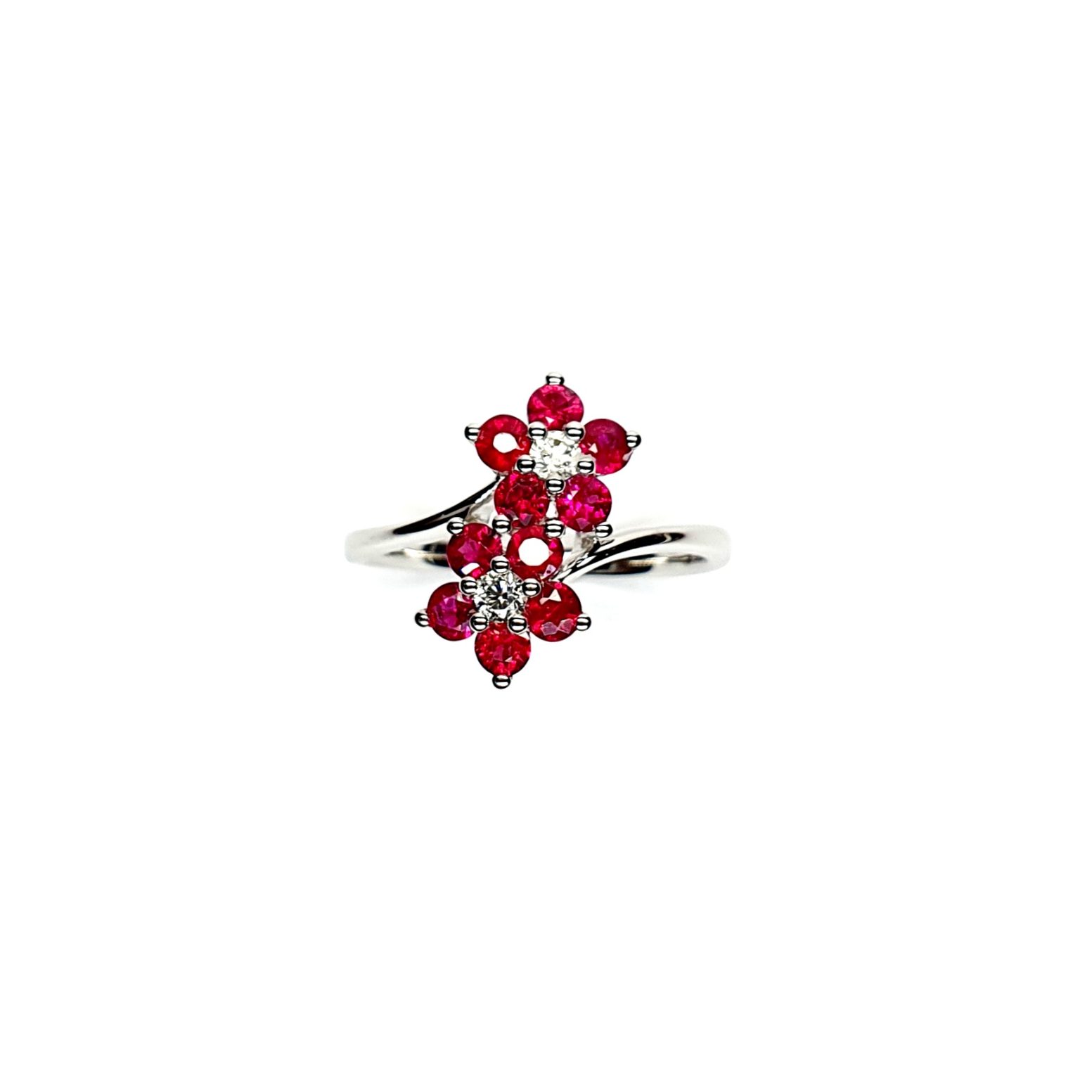 Ruby Double Cluster Ring with claw settings crafted in 18ct white gold featuring two clusters of five round bright red rubies with a single diamond centre to each cluster