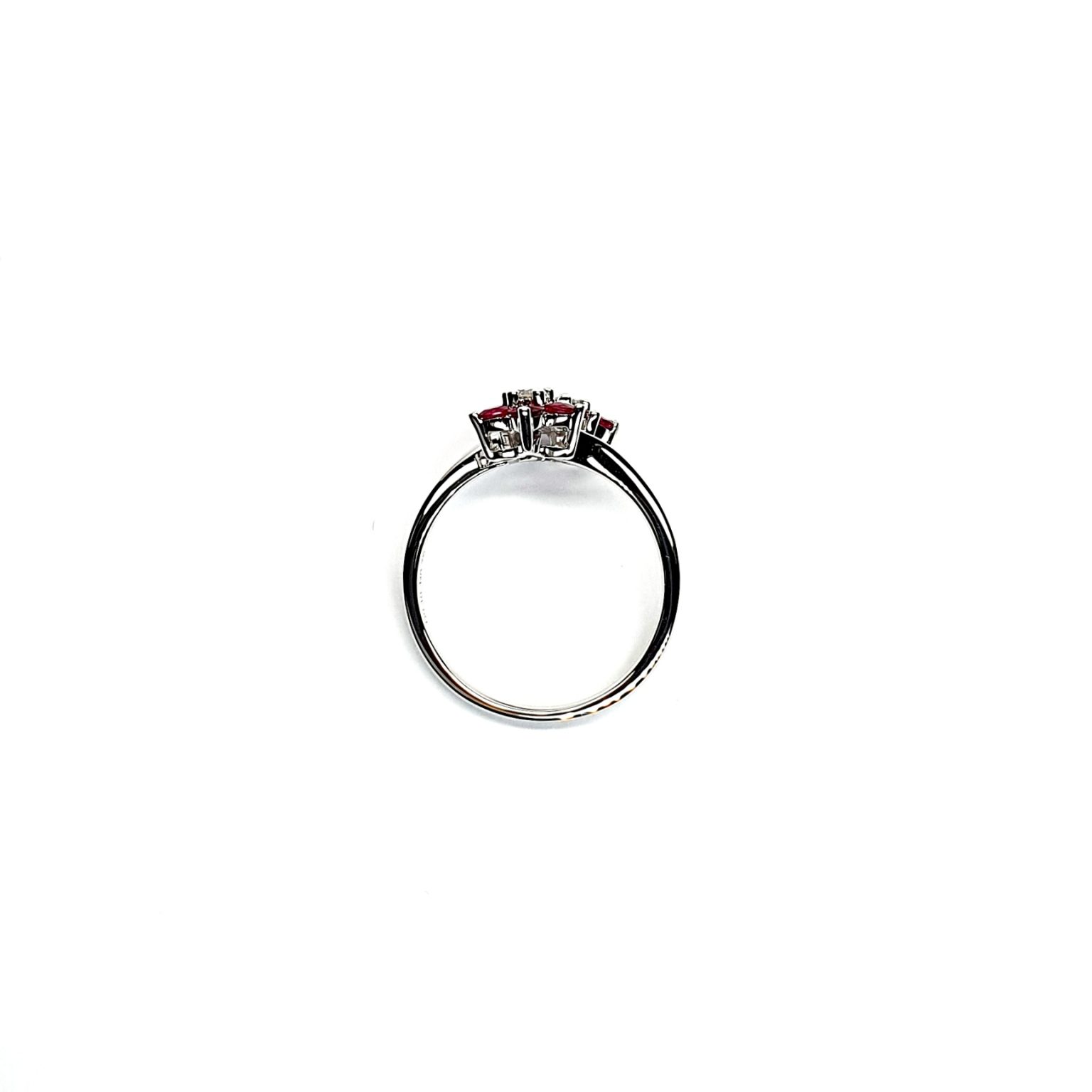 Ruby Double Cluster Ring with claw settings crafted in 18ct white gold featuring two clusters of five round bright red rubies with a single diamond centre to each cluster