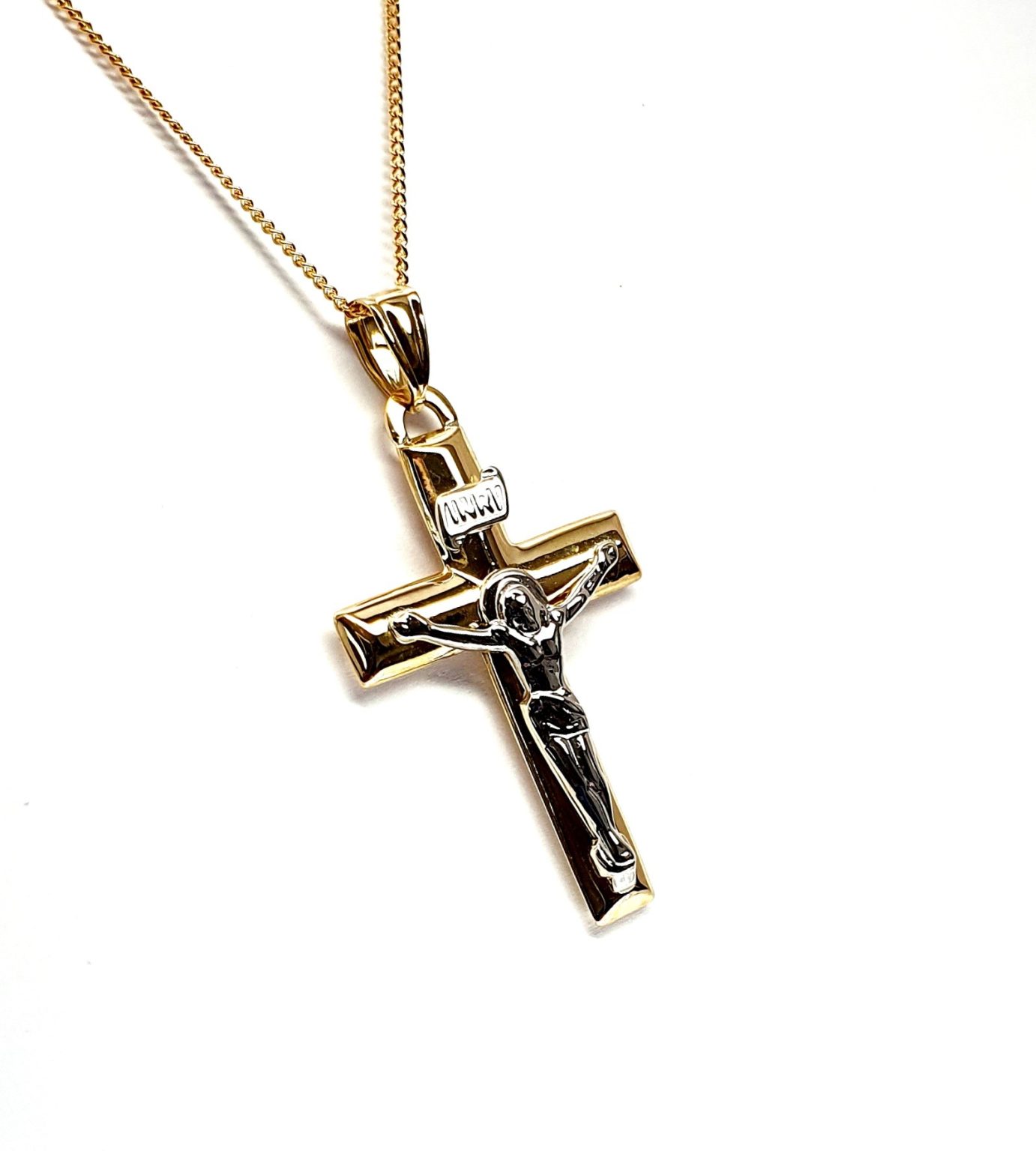 Tuebrook 9ct Yellow & White Gold Crucifix Necklace - A captivating necklace showcasing a yellow gold cross with intricate white gold Jesus and INRI detailing. The back is plain polished gold representing faith and elegance.