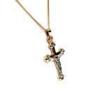 The Staveley 9ct Crucifix Necklace is 32mm with the top saddle loop 25mm x 16.8mm without and is 2mm in depth. It is made with a hollow 9ct yellow gold tube with a white gold Jesus, all highly polished. It can be purchased independently or with a 16, 18 or 20-inch traditional solid gold curb link chain.