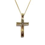 A yellow gold cross with an intricate white gold Jesus & a chris cross matt background with a contrasting sparkling diamond cut patterned edging.