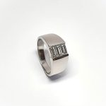 950 Platinum signet style ring set with three baguette diamonds in a landscape rub-over setting, showing at a 45% angle closer look with natural background