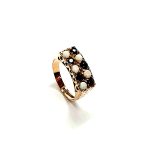 Vintage 1979 opal & dark blue sapphire 9ct gold landscape rectangular top ring measuring 18mm x 7.8mm set with five round cabochon cut opals & five round dark blue sapphires in a chequer formation with three hand engraved flowers to both—side shoulders.