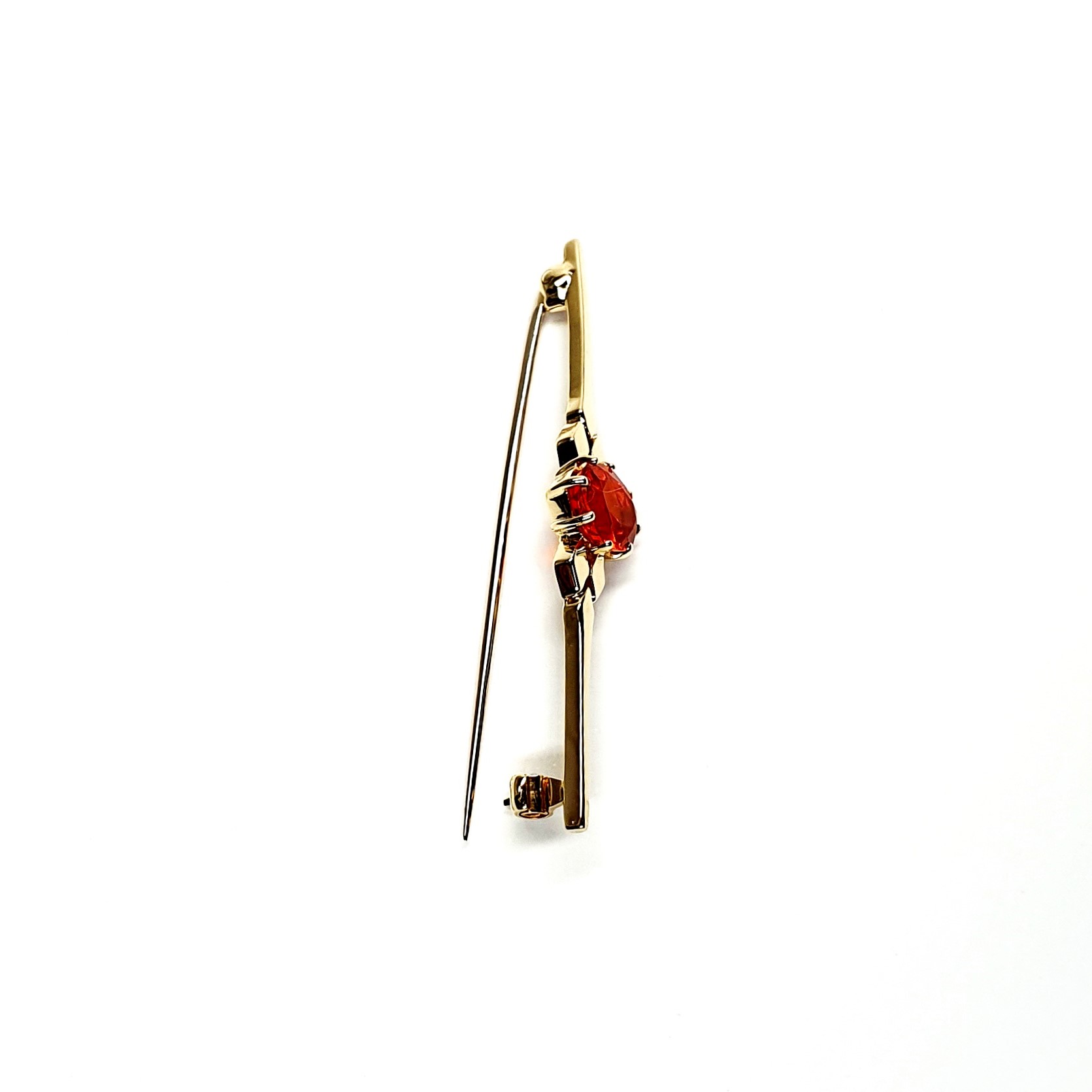 A handmade 9ct yellow gold bar brooch 52mm long set with a gorgeous top quality oval fire opal measuring 8.6mm x 7mm portrait set to the middle of the bar with three 9ct gold diamond shapes to each side of the stone with a straight pin to the back with a swivel safety catch.