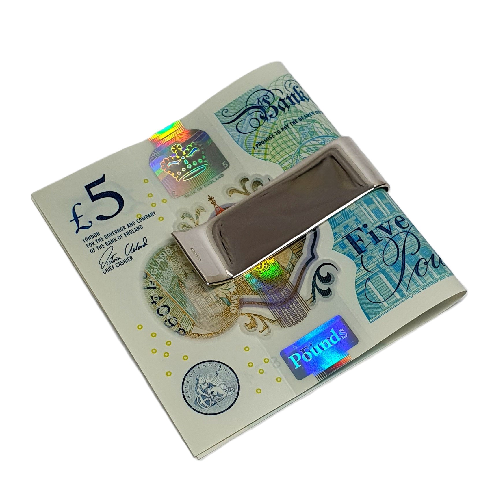 The hallmarked sterling silver scroll-engraved money clip with a plain rectangular-centred cartouche is suitable for initials. This picture shows the back with a five-pound note of plain polished silver, showing the Hallmark to one end.