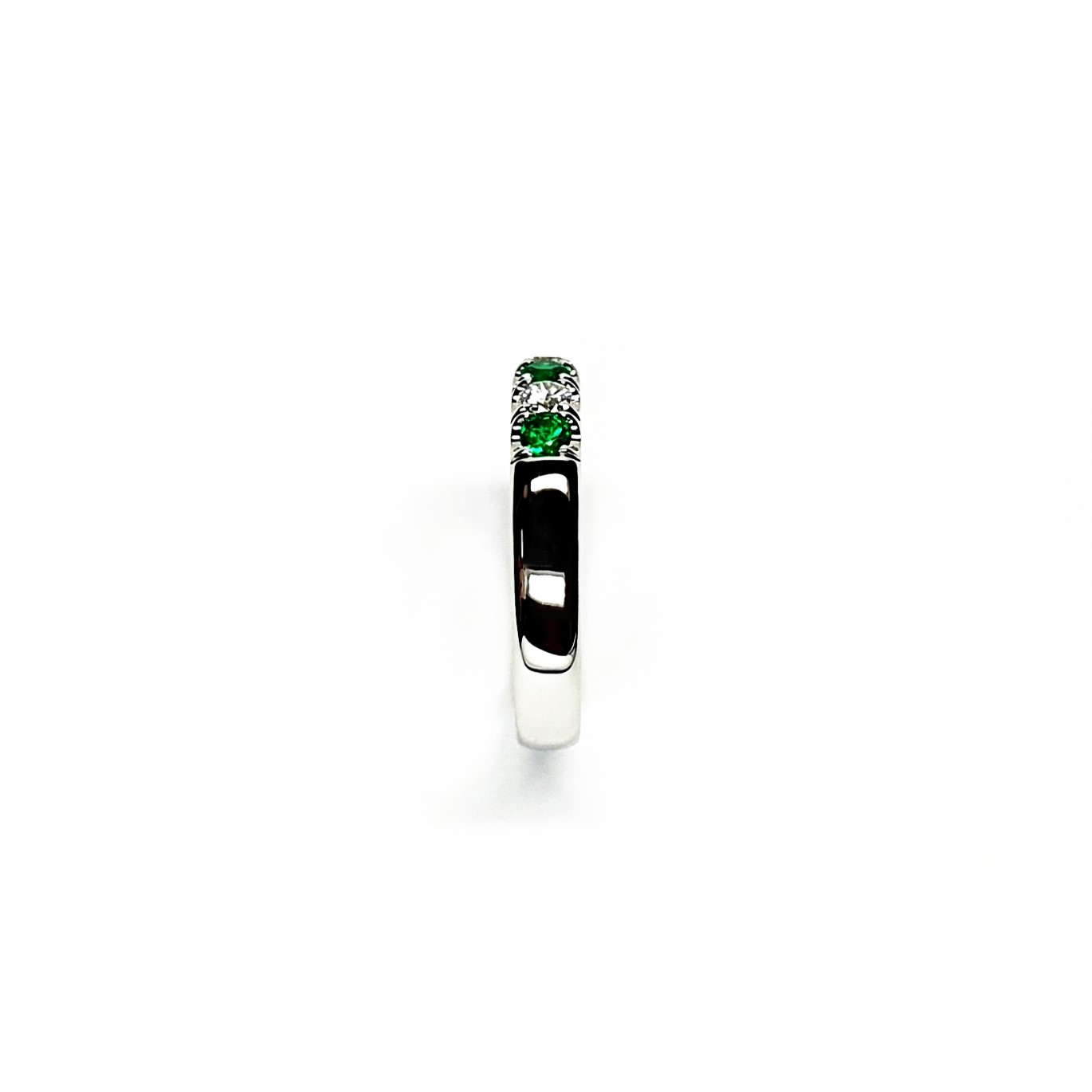 18ct White Gold Emerald & Diamond Eternity Ring RA00685 Four 2.8mm round emeralds and three 2.8mm round diamonds ring standing up side shoulder view.