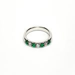 18ct White Gold Emerald & Diamond Eternity Ring RA00685 Four 2.8mm round emeralds and three 2.8mm round diamonds ring laying down front view.