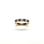 18ct Yellow Gold Emerald & Diamond Eternity Ring RA00686 Four 2.8mm round sapphires and three 2.8mm round diamonds ring standing up to the front angled facing to the front.