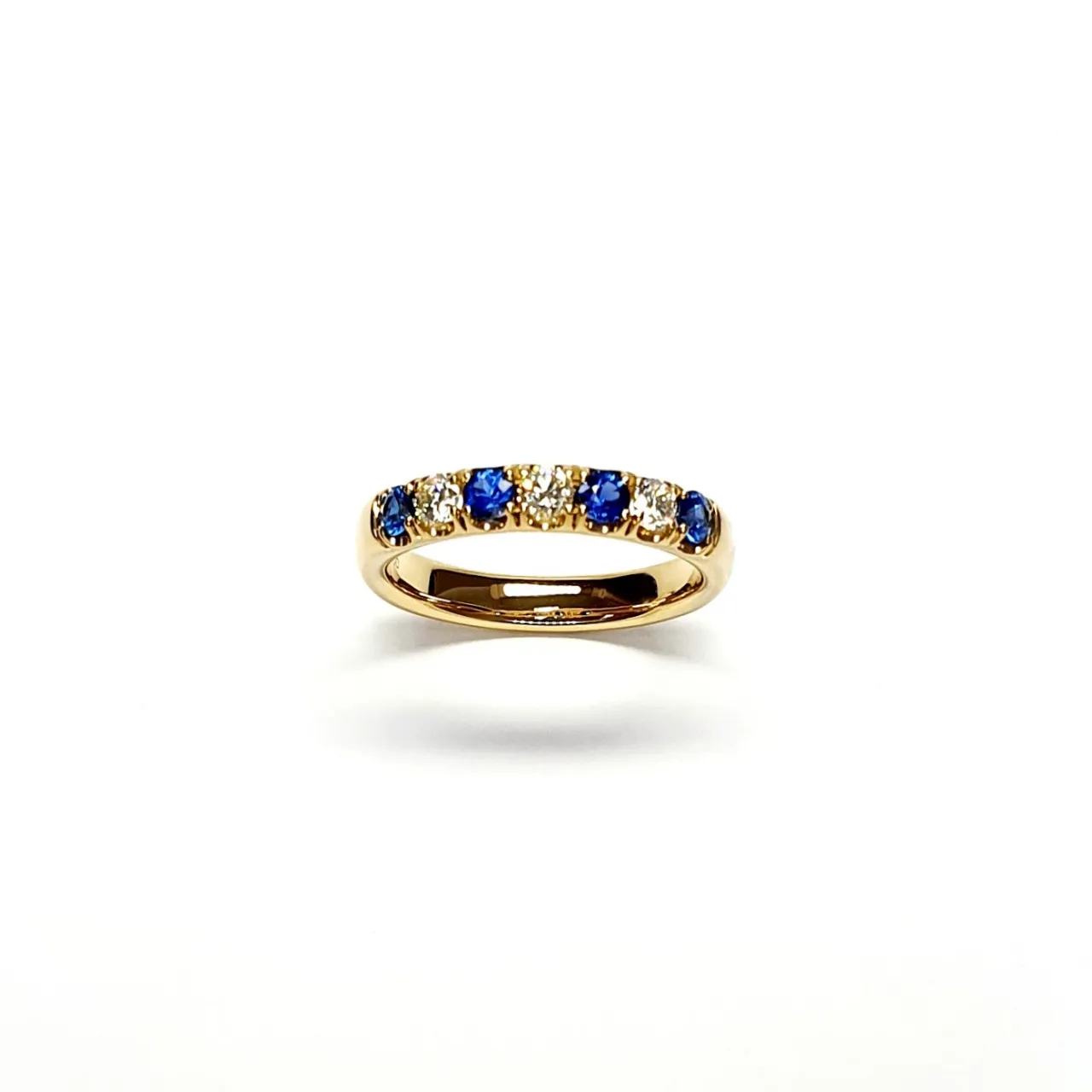18ct Yellow Gold Emerald & Diamond Eternity Ring RA00686 Four 2.8mm round sapphires and three 2.8mm round diamonds ring standing up to the front angled facing to the front.