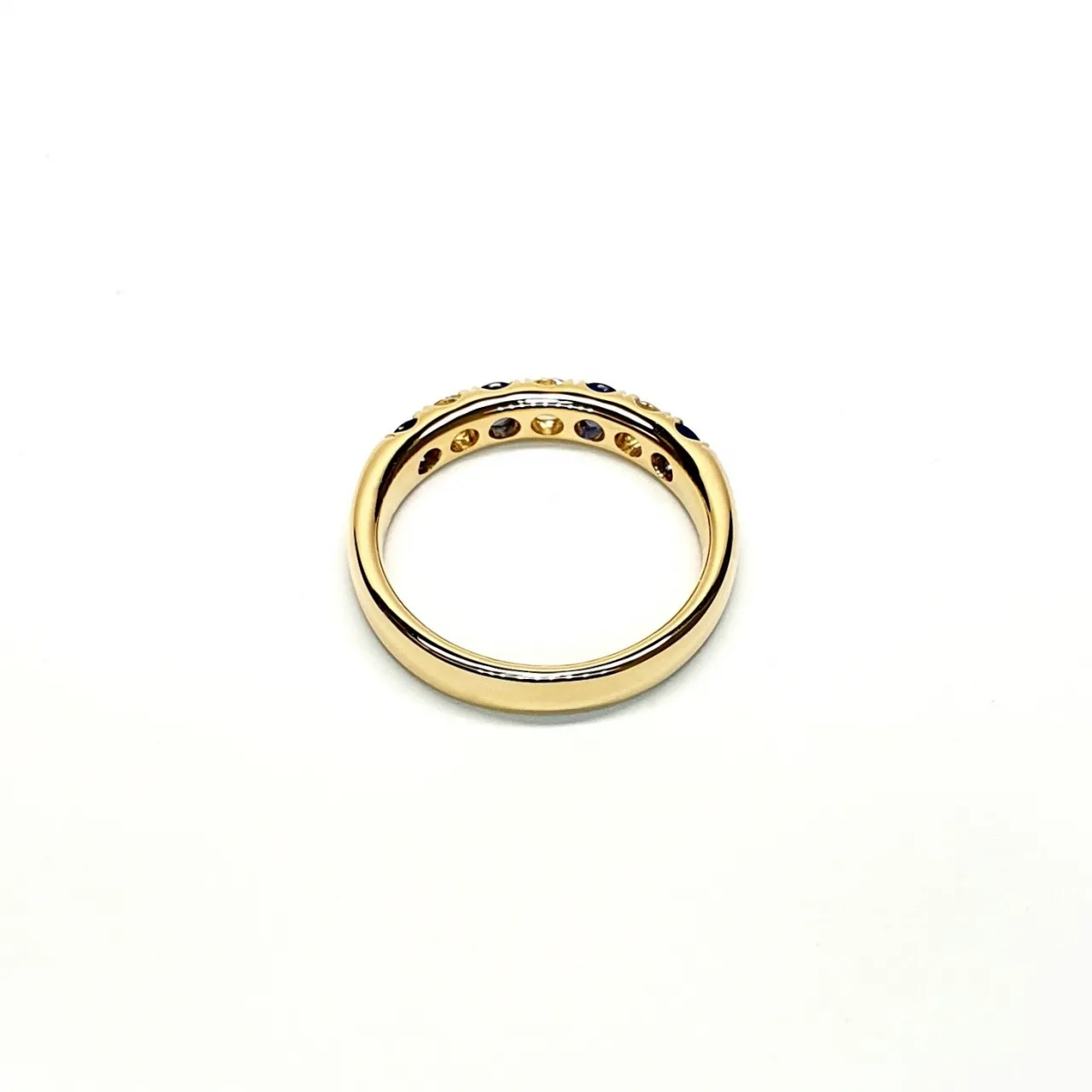 18ct Yellow Gold Sapphire & Diamond Eternity Ring RA00686 Four 2.8mm round sapphires and three 2.8mm round diamonds ring laying down view of the back.