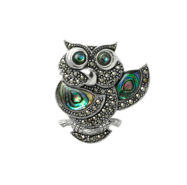 Designed and made in Britain in sterling silver and marcasites, this owl brooch is truly unique due to the use of multi-coloured abalone shell to the wings and eyes no two brooches are the same.