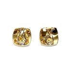 Measurements 16mm x 16mm. And 19mm corner to corner Handmade 18ct yellow gold curved cushion-shaped clip-on earrings with an 18ct white gold wave going from corner to corner set with seven graduated round white diamonds to each earring.