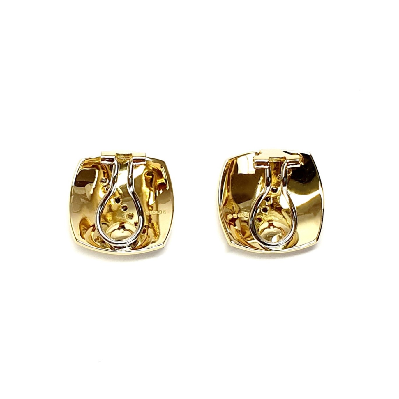 Measurements 16mm x 16mm. And 19mm corner to corner Handmade 18ct yellow gold curved cushion-shaped clip-on earrings with an 18ct white gold wave going from corner to corner set with seven graduated round white diamonds to each earring.